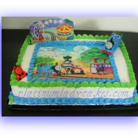 Thomas And Friends This was a cake for a 4 year old boy...I didn't realize I put the wrong age on until I was getting ready to take the cake inside &amp...