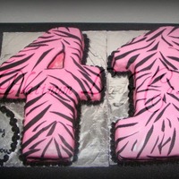Zebra Pink & Black Numbers This was my first time carving numbers ... Each number was craved from a half sheet cake then covered in fondant Didn't have a stencil...