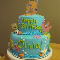 Spongebob Cake! This is a 2 tier cake with vanilla and chocolate cake. All buttercream icing, white chocolate shells, and Spongebob, Patrick, and the...