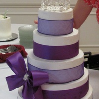 Purple Princess 5 tier, white buttercream and purple ribbon