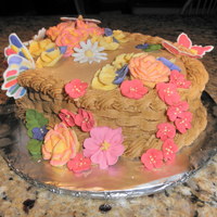 Course Ii Final Cake Iced in BC. Royal icing flowers and color-flow butterfly accents.