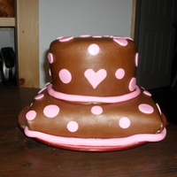 Brown And Pink Dots I made this cake for a baby shower. It's yellow cake with buttercream frosting covered with fondant.