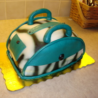 Zebra Purse My first purse and fondant cake. I made it for my 19th birthday. It was actually alot easier than I thought. :)