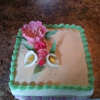 Rose And Calla Lily Cake Coconut cake with white chocolate truffle filling and key lime buttercream topped with a fantasy flower, fondant roses and calla lillies