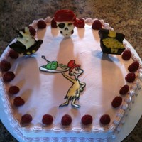 Dr Suess/pirate Cake Hexagon shaped dark chocolate truffle raspberry cake with white chocolate filling and raspberry cream cheese filling topped with whipped...