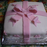 Gift Cake - Course 3 Final Cake from Course 3 - Buttercream iced cake with White Fondant and Pink Fondant Bow with decorations. Fondant didn't roll out as...