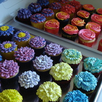 Jewel Toned Floral Cupcakes Roses, dahlias, crazy daisies, begonias, and carnations in wild colors! For my cousin's baby shower to go with the baby blanket cake...