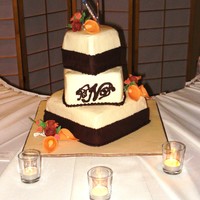 My First Wedding Cake Ever! Bottom tier butter cake with vanilla buttercream filling, second and third tiers chocolate cake with vanilla buttercream filling, frosted...