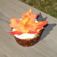 Maple Leaf Cupcake! Maple Pecan cupcake with maple cream cheese frosting. Topped with an autumn colored white chocolate maple leaf