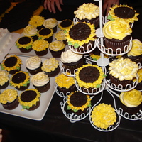 Graduation Floaral Cupcakes Made in the school colors of gold and black. A Kansas school, so I made sunflowers in addition to my normal flowers