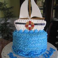 Sailboat This is a sail boat birthday cake i made for a friends dad.It's a banana cake with a banana pudding filling and vanilla butter cream....