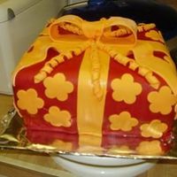 Red_Present_Cake.jpg This cake was made from scratch with pineapple filling and cherry flavor Italian Meringue. MMF was also cherry flavor. It was suppose to be...