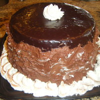 Choc Fudge Cake choc fudge cake, raspberry ganache filling (Yummy!), covered in ganache, then added whipped ganache with whipped cream peaks up the sides....