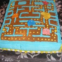 Pacman Mania The game board is chocolate MMF and the Ghost and PacMan are rolled out candy. This was a great cake to do. I had lots of fun. Hope I get...