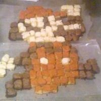 Old School Mario This is 162 separately iced tiny pieces of cake. Each individually covered with chocolate fudge, vanilla, and red butter cream. And all...