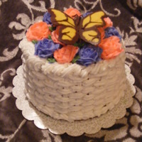 Butterfly Basket Weave this was my first basket weave cake. It was a chocolate cake with chocolate and vanilla BC. The roses are Vanilla BC an the butterfly is...