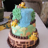 Lion 1St Birthday All chocolate and MMF. Top tier is the smash cake and is buttercream. I used aero balls for the trim. I loved how it turned out.