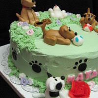 Puppies, Puppies Everywhere!! I made this cake for a special little girl who is turning 6. Its going to be a complete surprise for her. 10' round rainbow cake. She...
