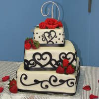 My First Wedding Cake Coverd in mmf used duff fondant for black and usred crickut cake