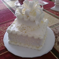 Anniversary Cake Anniversary cake I did - all buttercream with a fondant bow. You can't tell by the pic but I have little pearls on the bow as well as...