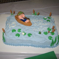 Fishin' Birthday Cake My son LOVES fishing - so I found a cake online that I loved, and based this one off it. It's frosted with BC but the boat, fisherman...