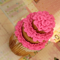 The 3 Tiered Cupcake Cake 3 Tiered cupcake with jumbo, regular and mini sized.