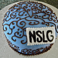 Best Friends Forever! This is a cake I made for my best friends and I. The scroll work is in chocolate icing and the tag is fondant painted with our initials...