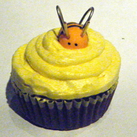 Bumblebee Cupcakes yellow buttercream icing with a fondant bee and wire wings and antannae