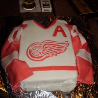 Redwings #40 This is a cake I made for a friend's birthday. Nobody wanted to cut into it. The emblem is made of 2 layers of fondant (red under...