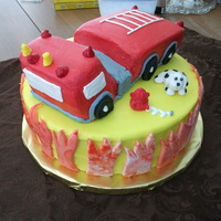 Fire Truck Cake This cake was huge. On a 12" round. Used loaf pans to make the fire truck. I struggled a bit with the truck as you may can tell....