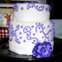 Purple Swirls And Flower A random cake a made for practice - lemon cake with fresh lemon juice and zest; covered in raspberry-lemon buttercream (which is why there...