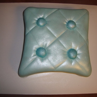 Pillow Cake My first pillow cake. MM fondant with pearl luster dust. I used mini nilla wafers and dipped them into poured fondant for the buttons.