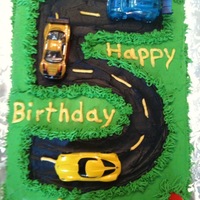Road Cake This was for a five-year-old little boy. It is all buttercream icing. The cars and the cones are toys. I found a lot of inspiration here on...