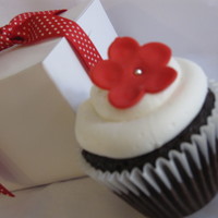 Red Flower Cupcake. Chocolate cake with snow white buttercream icing. Fondant flower with edible silver bead.