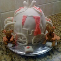 Cinderella Carriage Cake My first attempt at this. Had trouble covering the cake smoothly with fondant. As well the cake was soft , could not hold the mice....it...