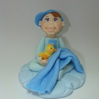 Lil'bebe Blue Hand modeled fondant cake topper.