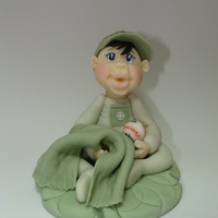 Lil Bebe Green Hand modeled fondant cake topper.