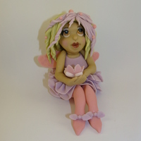 Flower Fairy Hand sculpted using fondant.