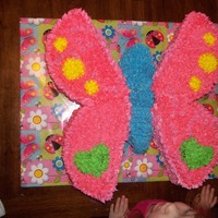 Butterfly Shaped Cake Wings are 2-10" rounds cut in half. Top wings are vanilla bottom are chocolate. Body is rice crispy treats. All covered in butter...