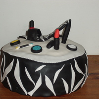 Fashionista Cake This is a cake I did for my sister-in-laws birthday. 12' round with fondant details. I used surge for the power which I tinted with a...