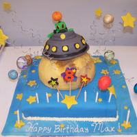 Out Of This World 12 inch square cake with vanilla cake, vanilla frosting, fondant covering, planets made out of fondant, moon out of rice crispy treats,...