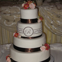 Wedding4-10 Fudge and marble layer cake with fudge and vanilla buttercream frosting. White chocolate fondant, sugar roses, satin ribbon and edible...