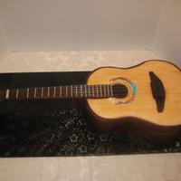 Guitar I made this guitar cake for a celebration for our new priest, who often plays his guitar at church. DH helped me engineer this. It was...