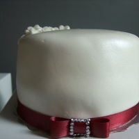 Red And White Wedding Cake And Cupcakes 