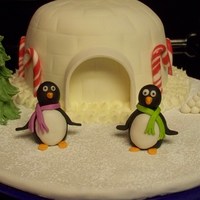 Penguin Birthday Cake This was made for my daughters 8th birthday. She loves penguins. Chocolate cake with bavarian cream filling.Everything is made of fondant/...