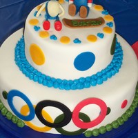 Mario And Sonic At The Winter Olympics (Wii Game) My son loves this wii game so I thought it was a good cake idea.Mario and sonic are both made of fondant as well as the olympic rings....