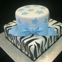 Zebra Baby Shower top is red velvet with bavarian cream filling and bottom is white with bavarian cream filling. All covered in fondant