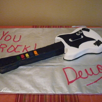 Guitar Hero Cake This is an WASC cake with buttercream and covered with fondant. This is my first 3D cake. I made this cake for my friends son. He loved it...