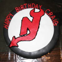 Devils Hockey Puck My first "non cake class" cake. Not as detailed as I would like, but not bad for a cake designed all on my own!