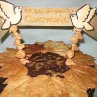 Gold Leaves German Chocolate Cake w/ Dark Chocolate Ganache and Chocolate decorations.
